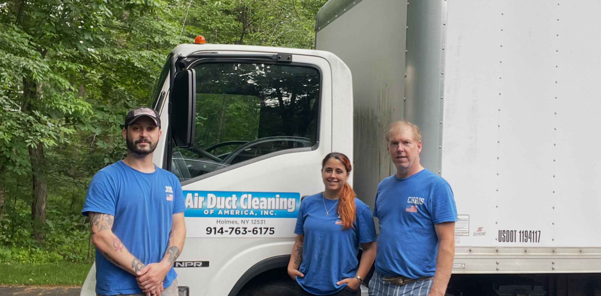 Air Duct Cleaning Of America crew in front of truck